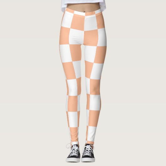 Geruite vierkanten perzik en witte geometrische re leggings (Voorkant)