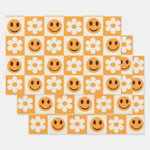 Geruite witte bloemen en oranje lachende gezichten inpakpapier vel