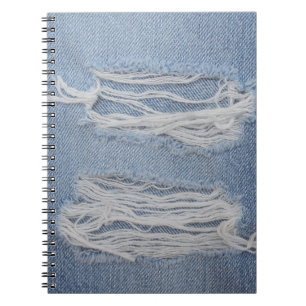 Gescheurd denim: blauwe jeans textuur. notitieboek