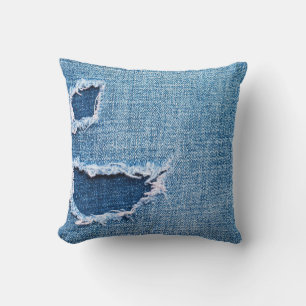 Gescheurde denim stof textuur, blauwe tinten. kussen