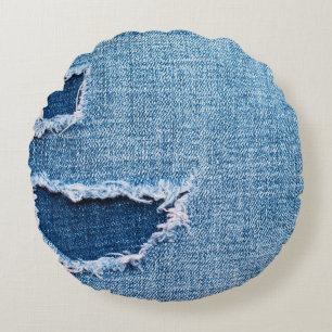 Gescheurde denim stof textuur, blauwe tinten. rond kussen