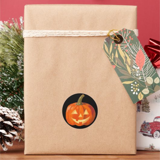 Geschilderd pompoen gezicht op zwart ronde sticker (Feestdagen)