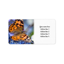 Geschilderde Lady Butterfly op een blauwe hortensi Etiket