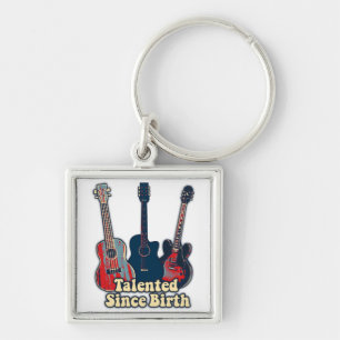 Getalenteerd sinds de geboorte. retrokleurige gita sleutelhanger