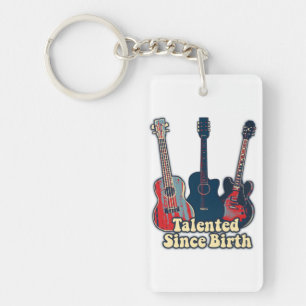 Getalenteerd sinds de geboorte. retrokleurige gita sleutelhanger