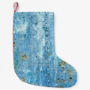 Getextureerde betonnen muur, roestvlekken. kleine kerstsok