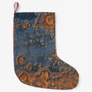 Getextureerde geroest metalen achtergrond. kleine kerstsok
