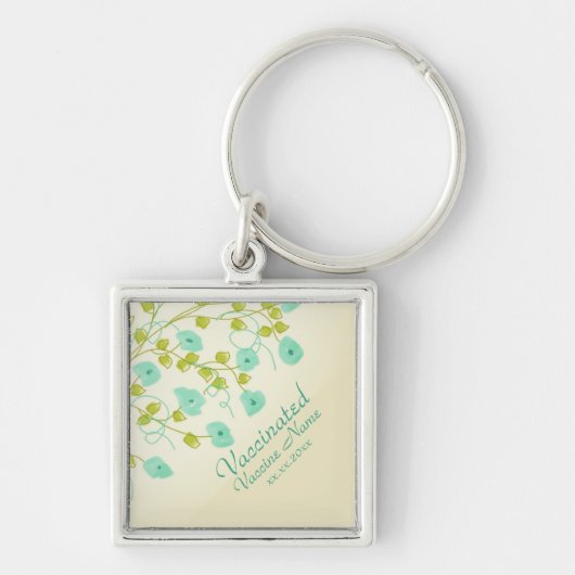 Gevaccineerde melding met turquoise bloemen sleutelhanger (Voorkant)