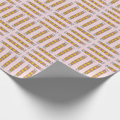 Gewalste snoepjes van snoep op roze cadeaupapier (Hoek)