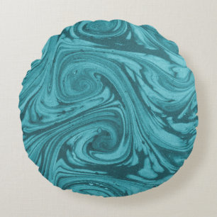 Gewapende en gebogen achtergrond in tonnen turquoi rond kussen