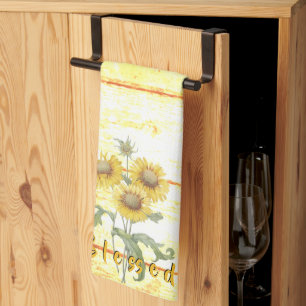Gezegende zonnebloemen op houten keukendoek theedoek