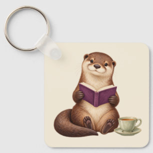 Gezellige lezende otter met paars boek en thee sleutelhanger