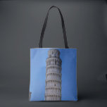 Gift Bag Tote Bag<br><div class="desc">This captivating photograph showcases the iconic Leaning Tower of Pisa standing elegantly against a deep blue twilight sky in Pisa. The historic marble tower, famous for its unmistakable tilt, is beautifully illuminated, highlighting its intricate Romanesque arches and layered columns. The soft evening light creates a striking contrast between the glowing...</div>