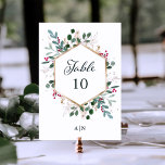 Gilded Greenery over White | Kerstbruiloft Kaart<br><div class="desc">Deze prachtige huwelijkstafelnummers zijn voorzien van een faux gold geometrisch lijst met bijpassende gouden bladeren,  kerstgroen en rode hulstbessen op een knapperige witte achtergrond. Perfect voor uw elegante winterbruiloft.</div>