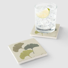 Ginkgo laat achtergrondkleuren achter stenen onderzetter