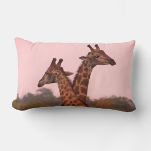 Giraffes met een roze lucht kussen