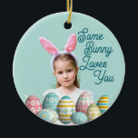 Girl Photo Bunny Ears Cute Blue  Keramisch Ornament<br><div class="desc">Girl Photo with funny Easter Bunny Ears and painted eggs on blue background on your own Easter ceramic ornament. May be a keepsake for yourself, or a personalized gift for a friend or family member. Generative content images may be changed. Humor Greeting saying "Some Bunny Loves You" on the front...</div>