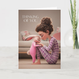 Girl Sitting with Bunny in Pajamas Thinking of You Kaart