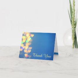 Glanzende harten op blauwe elegante  bedankkaart