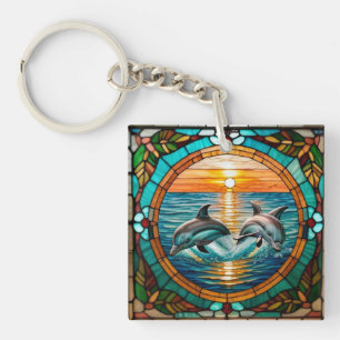Glas-in-loodkunst met springende dolfijnen bij zon sleutelhanger
