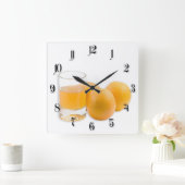 Glas van het sap en de drie sinaasappels vierkante klok (Huis)