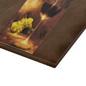 Glas van wijn en groene druiven van kaarslicht snijplank (Hoek)