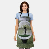 Glazen golfbal met golfspeler binnen, schort (Gedragen)