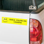 GLIMLACH, JE STAAT OP DE CAMERA BUMPERSTICKER (Op Truck)