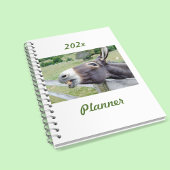 Glimlachende Ezel in weiland met hond Planner