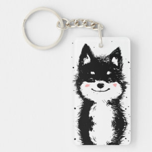 Glimlachende zwarte en witte hond sleutelhanger