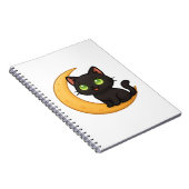 Glimlachende zwarte kat met gloeiende groene ogen  notitieboek (Rechterzijde)
