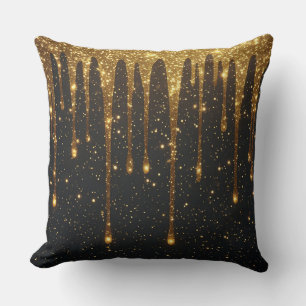Glinsterend goud glitter druppels over donkere ach kussen