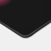 Gloeiend roze effect op zwart bureaumat (Hoek)