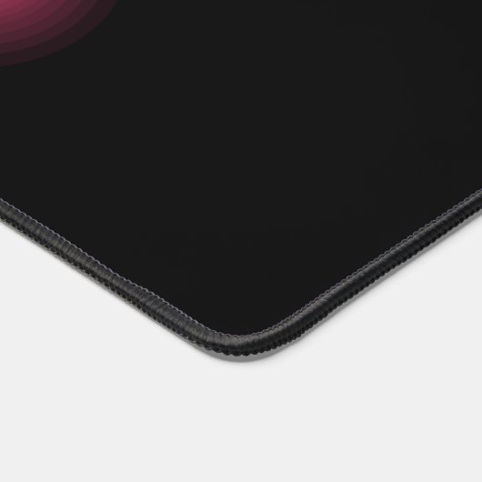 Gloeiend roze effect op zwart bureaumat (Hoek)