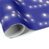 Gloeiende gloeilampen op blauw cadeaupapier (Rol Hoek)