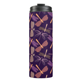 Gloeiende nachtlibellen op de achtergrond van de d thermosbeker