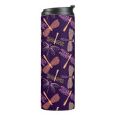 Gloeiende nachtlibellen op de achtergrond van de d thermosbeker (Gedraaid links)