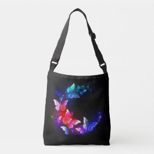 Gloeiende neon nacht vlinders op zwarte achtergron crossbody tas
