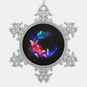 Gloeiende Neon Nachtvlinders op Zwarte achtergrond Tin Sneeuwvlok Ornament
