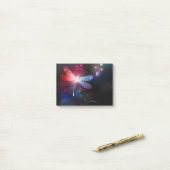 Gloeiende rode libellen post-it® notes (Op bureau)