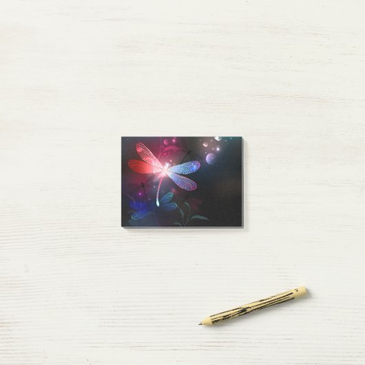 Gloeiende rode libellen post-it® notes (Op bureau)