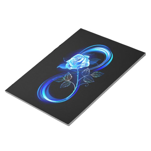 Glowing infinity with blue rose notitieblok (Schuin)