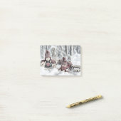 Gnomen in een winternotitie post-it® notes (Op bureau)