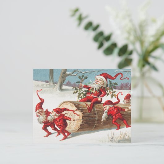 Gnomes dragging a cut tree trunk through the snow briefkaart (Staand voorkant)