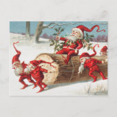 Gnomes dragging a cut tree trunk through the snow briefkaart (Voorkant)