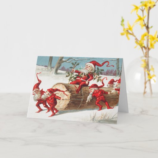 Gnomes dragging a cut tree trunk through the snow kaart (Gele Bloem)