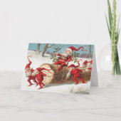 Gnomes dragging a cut tree trunk through the snow kaart (Voorkant)