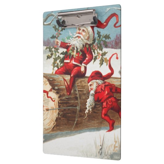 Gnomes dragging a cut tree trunk through the snow klembord (Links)