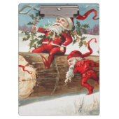 Gnomes dragging a cut tree trunk through the snow klembord (Voorkant)