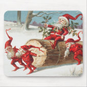 Gnomes dragging a cut tree trunk through the snow muismat (Voorkant)